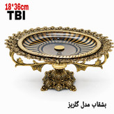 شیرینی خوری پایه دار مدل گلریز با کاسه کریستال شفاف و لبه و پایه برنجی پرکار مزین به نقوش گلهای برجسته محصول برند متالوکس